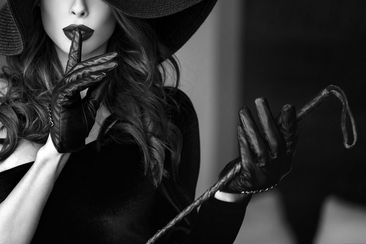 Woman in hat and whip showing no talk, Beginners Guide to BDSM, by Healthista.com